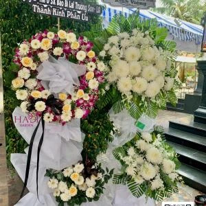 25102503 - Kệ hoa chia buồn mix lan tím