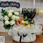 23022609 - giỏ hoa trái cây chia buồn