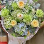24022613 - bó hoa tone xanh bơ pastel
